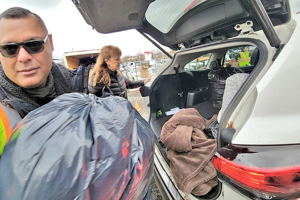 A 91ԭ drive-thru donation drive to help Abbotsford flood victims raised more than $57,000 and filled three five-ton trucks on Saturday, Nov. 20. (Dan Ferguson/91ԭ Advance Times)