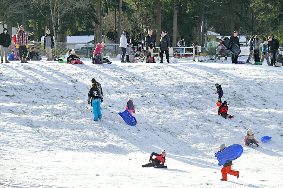 The slope near George Preston recreation centre was busy with sleds and toboggans on Monday, the day temperatures fell to a record low. (Dan Ferguson/91ԭ Advance Times)