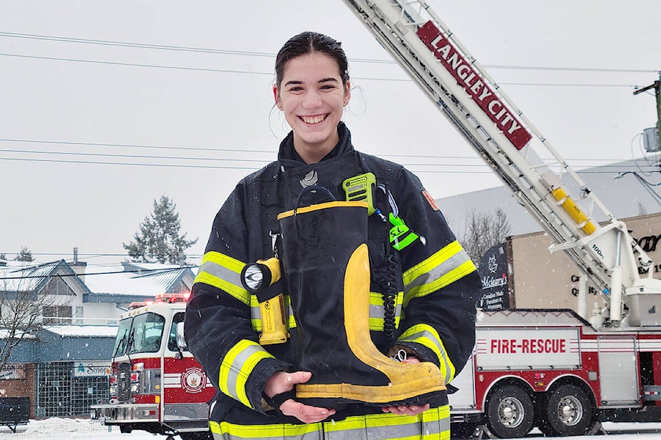 Tessa Schnare greeted visitors with a boot for cash contributions at the Langley City paid on-call firefighters first-ever tree chipping and bottle drive fundraiser on Jan. 8 and 9 at the former Gabby’s Cabaret site. (Dan Ferguson/Langley Advance Times)
