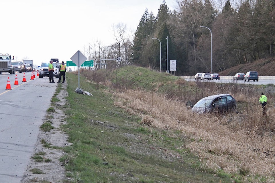One person was transported to hospital what appeared to be serious injuries after a car ended up in the ditch on the eastbound lane of Hwy. 1 near 216th St. on Tuesday, March 1. in the middle of the afternoon. (Shane MacKichan/Special to Langley Advance Times)