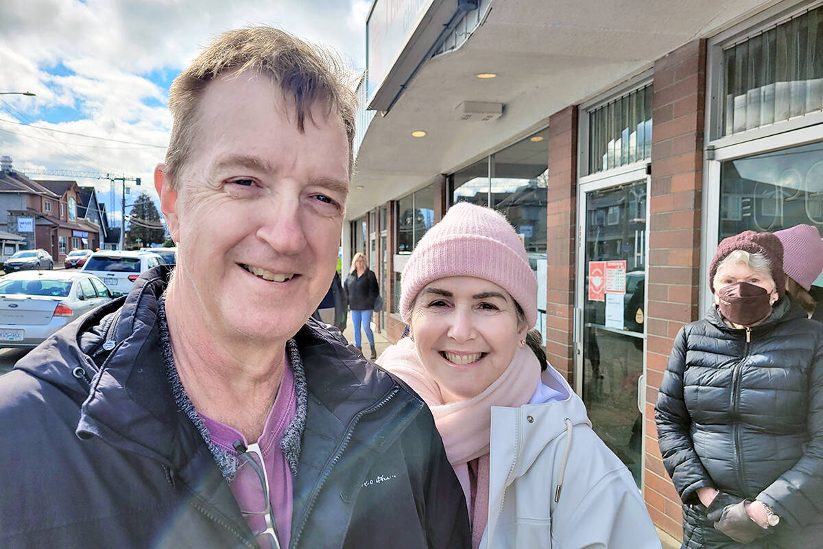 Mark and Victoria Blinkhorn, with Victoria聮s mom, Sylvia Kendall (right) were among the many who waited in line on Saturday, March 19, at Veronica聮s Gourmet Perogies owner Veronica Cave raised more than $5,000 for the besieged country by selling deep fried apple cinnamon perogies on Saturday, March 19. (Dan Ferguson/91原创 Advance Times)