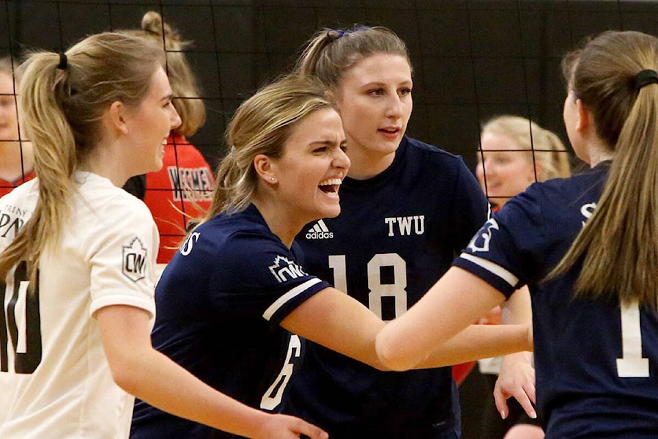 28595806_web1_200222-LAT-TWU-volleyball-celebrating_1