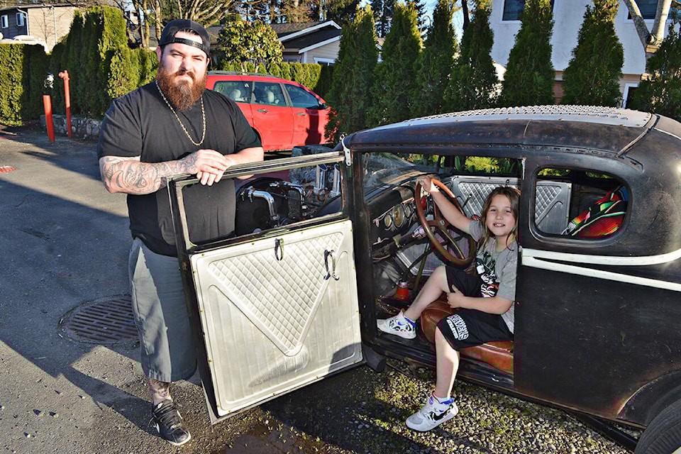 Rob Myles brought out his hotrod for jaunts around Aldergrove on a warm spring evening Friday, April 1, with family, including his daughter, Natalia. (Heather Colpitts/91ԭ Advance Times)