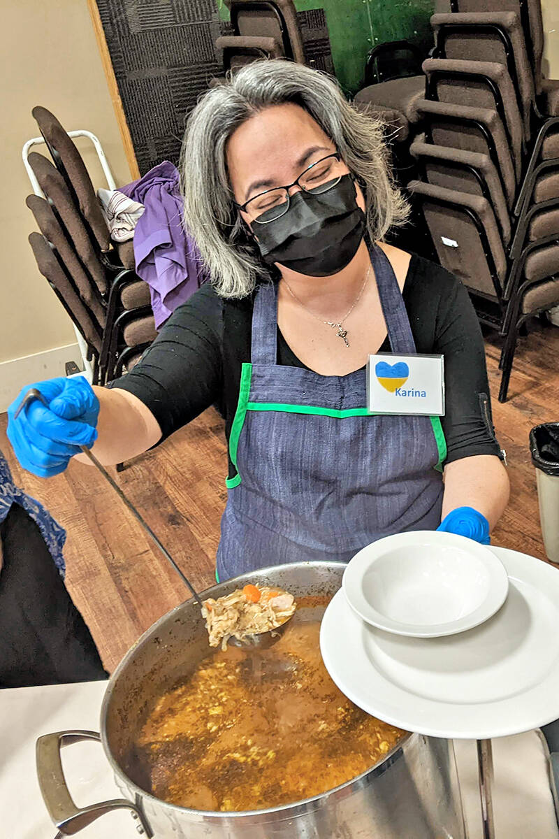 Volunteer Karina helped to serve Sunday meal of homemade soup, buns, and dessert Sunday, April 10, to kore than 300 at the South 91原创 Church. A fundraiser for Ukraine relief, the event raised more than $47,000 for Ukraine relief. (Cam Penner/Special to 91原创 Advance Times)