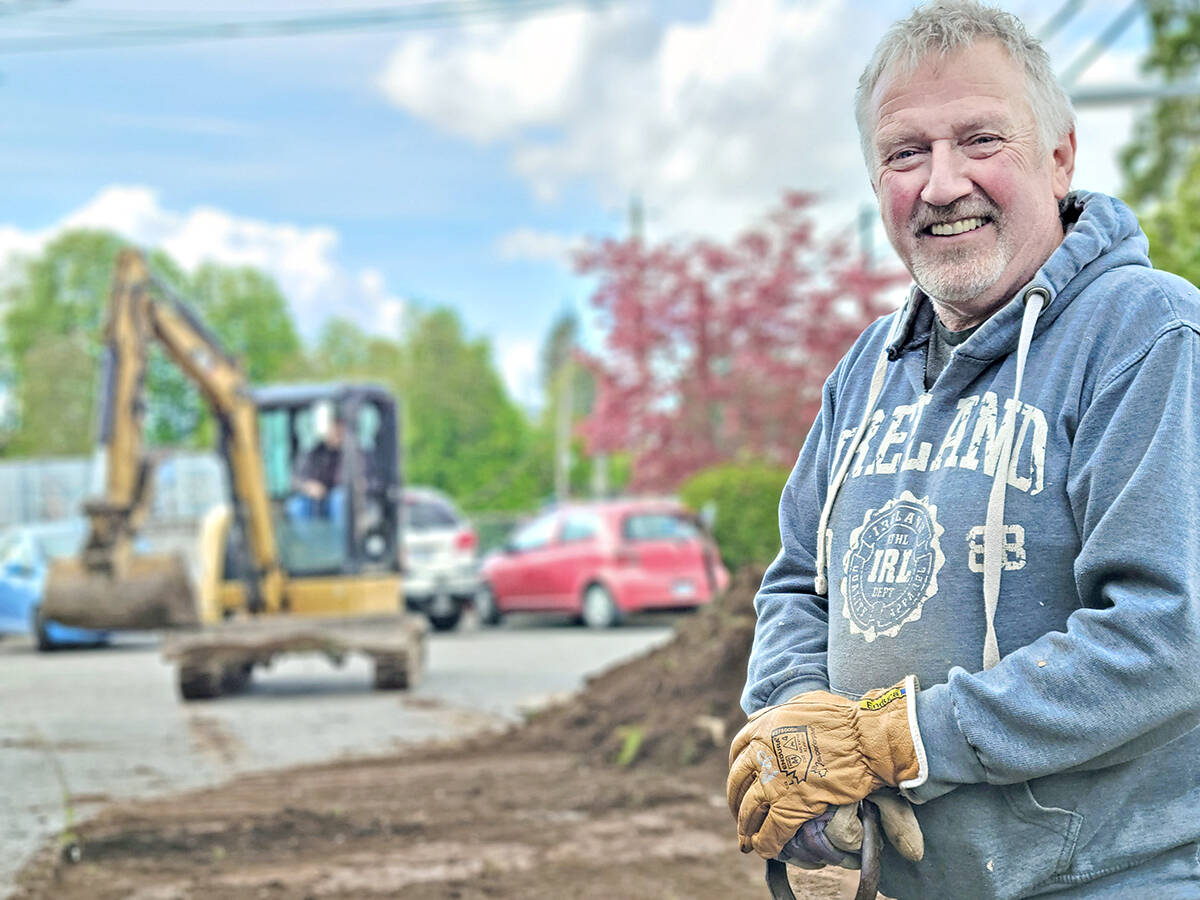Rob Robinson was among the volunteers working on new garden beds at the new Aldergrove Meals on Wheels on Tuesday, May 10. Robinson used to operate the Milsean Shoppe chocolatier and coffee shop at the location. (Dan Ferguson/Langley Advance Times)