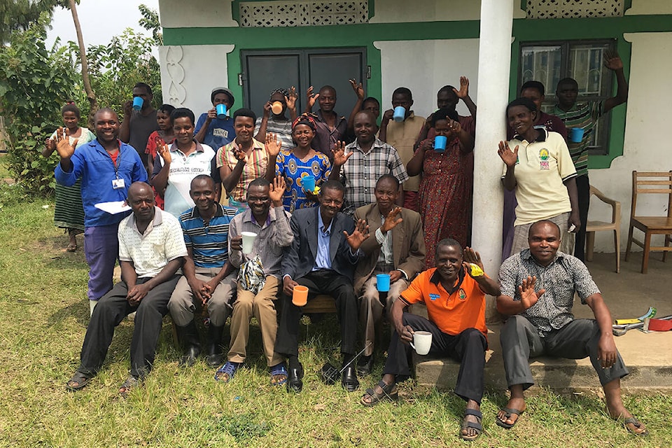 Coffee farmers in Uganda, who work with Kingsley Griffin enjoying the first batch of coffee that they all grew together. (Contributed photo)