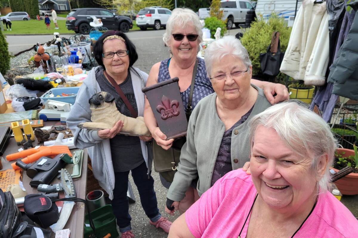 Friends (left to right) Vicky Gammon, Elaine Daoust, Marilyn McEwan and Debbie Hayward oversaw the activity at Daoust聮s home during the 91原创 Township-wide Garage Sale on Saturday, May 28. (Dan Ferguson/91原创 Advance Times)