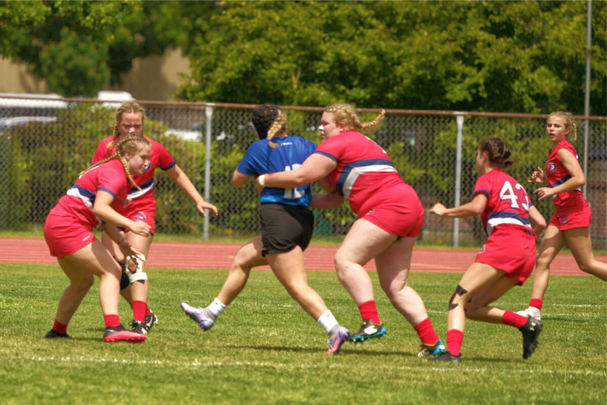 D.W. Poppy Redhawks wrapped up an undefeated season by taking gold at the B.C. Secondary School Rugby Provincial championship in Abbotsford June 4, the first time girls rugby was included in the event. (Special to 黑马磁力)