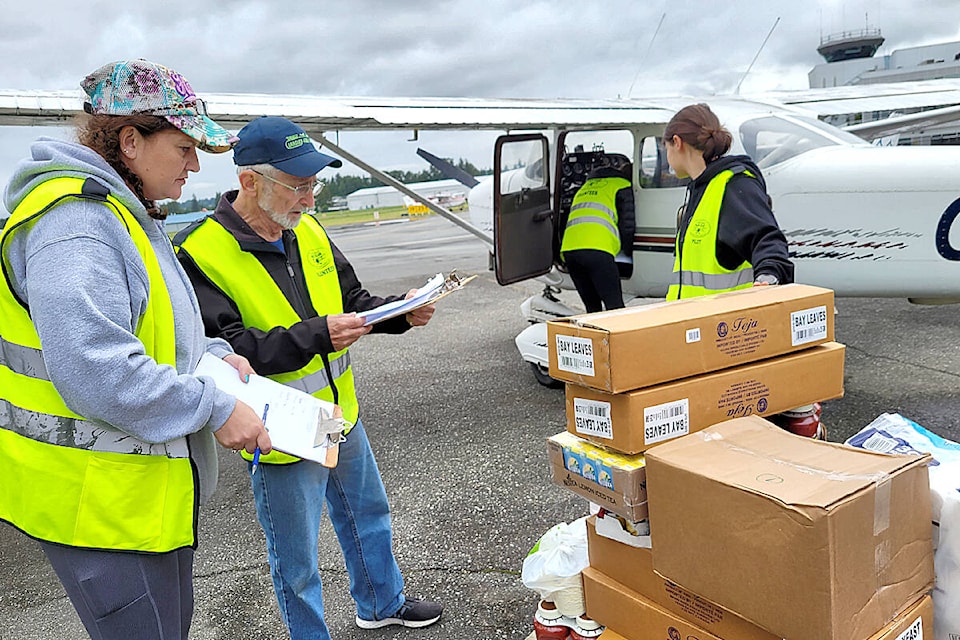 A dozen planes ferried supplies across the Canada-U.S. border from Langley Airport on Saturday, June 18, during “Operation Thunder” an exercise in disaster preparedness. (Dan Ferguson/Langley Advance Times)