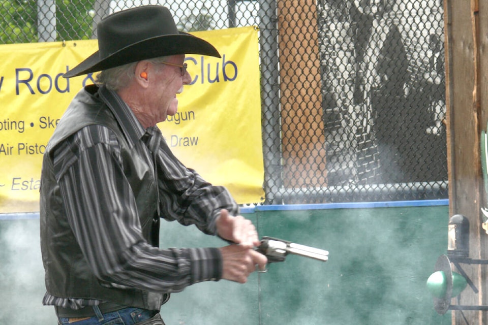 Dan Holliday drew and fired in a blur of motion during a fast draw competition Saturday, July 16 at the Aldergrove fair. (Dan Ferguson/91ԭ Advance Times)
