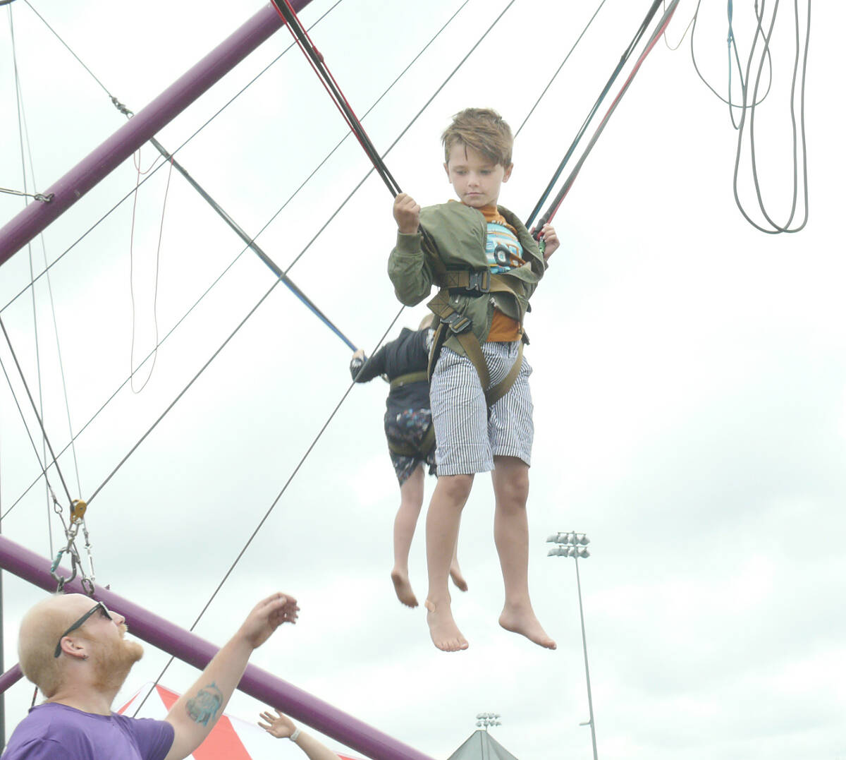 Max White, 7, from Aldergrove, tried out the bungee jump at the Aldergrove Fair on Sunday, July 17. (Dan Ferguson/91ԭ Advance Times)
