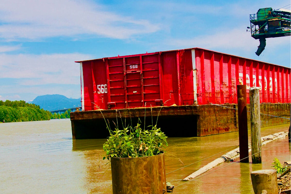 Dorothy Mckay shares a picture of a barge being loaded along the shores of the Fraser River in North Langley. (Special to Langley Advance Times)
