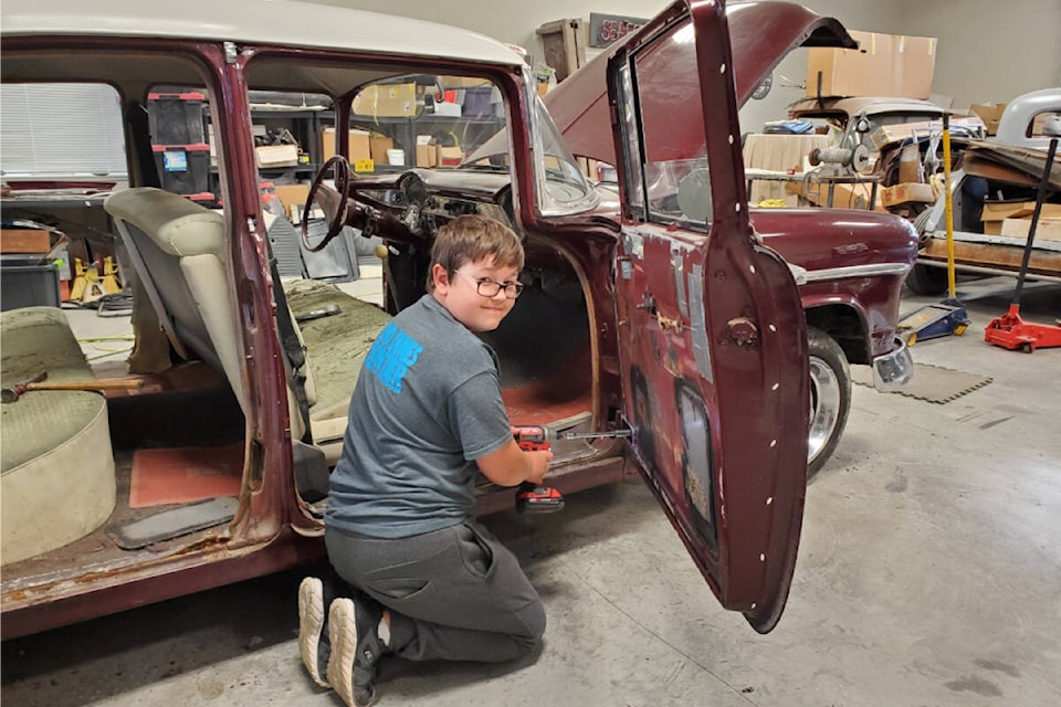Jackson Foxley with his 1955 Chevy, which he and his dad, John, rebuilt during COVID. The project took about 10 months. Jackson is 15, and can’t wait to get his licence. (John Foxley/Special to Langley Advance Times)