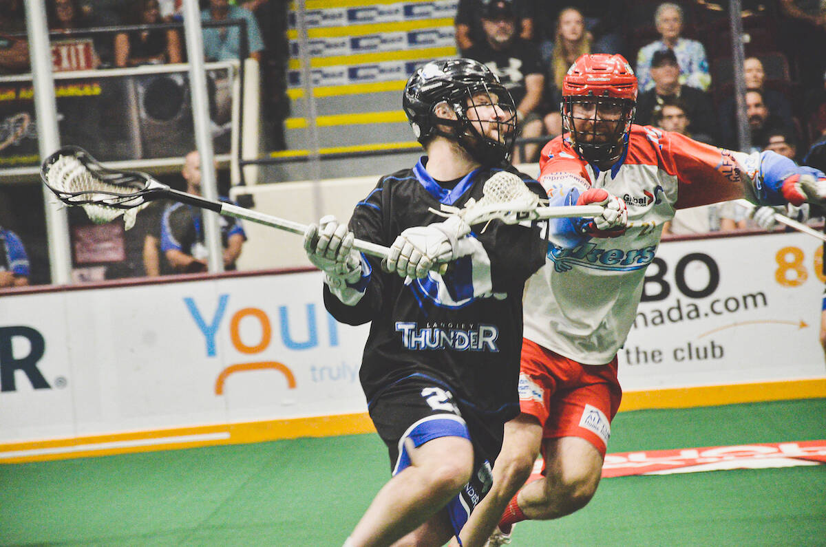 Thunder player Robert Church forced his way past a Laker Saturday, Sept. 10 as Langley defeated the Peterborough Lakers for their second win of the Mann Cup. (Gary Ahuja/Langley Events Centre)