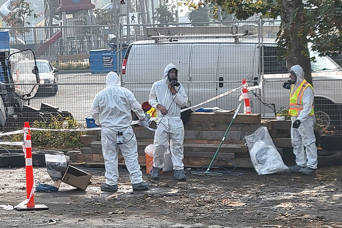 Work on the demolition of the Township-owned Aldergrove Plaza site at Fraser Hwy. and 270th Street was wrapping up Oct. 19, with workers in haz-mat suits bagging potential contaminated debris. (Dan Ferguson/91原创 Advance Times)