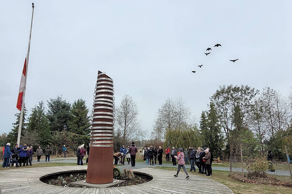 A small group gathered at the Afghanistan war memorial at Derek Doubleday Arboretum in Langley on Remembrance Day. (Leanne Hofsink/Special to Langley Advance Times)