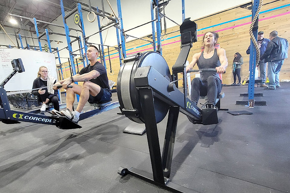 Tyler DeJong and Mandy Kirkpatrick were rowing for Honour House on Saturday morning, Nov. 12, as a 24-hour fundraising rowathon drew to a close in Langley. (Dan Ferguson/Langley Advance Times)