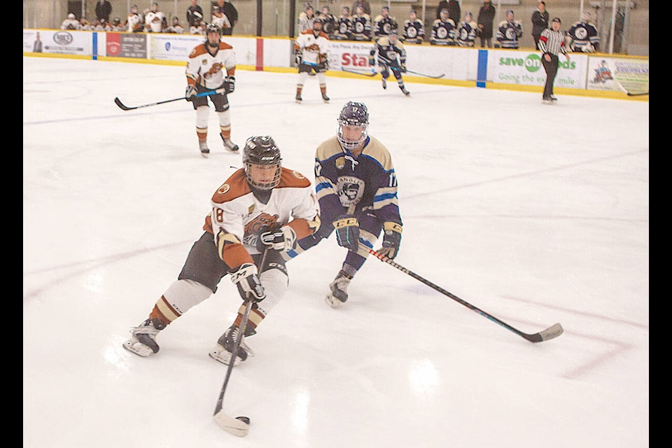 Kodiaks Isaiah Fernandez and Trappers Anthony Bosnjak chased the puck Nov. 9 at Aldergrove Credit Union Community Arena, the two Langley teams’ second meeting of the season. (Kurt Langmann/Special to Black PressMedia)