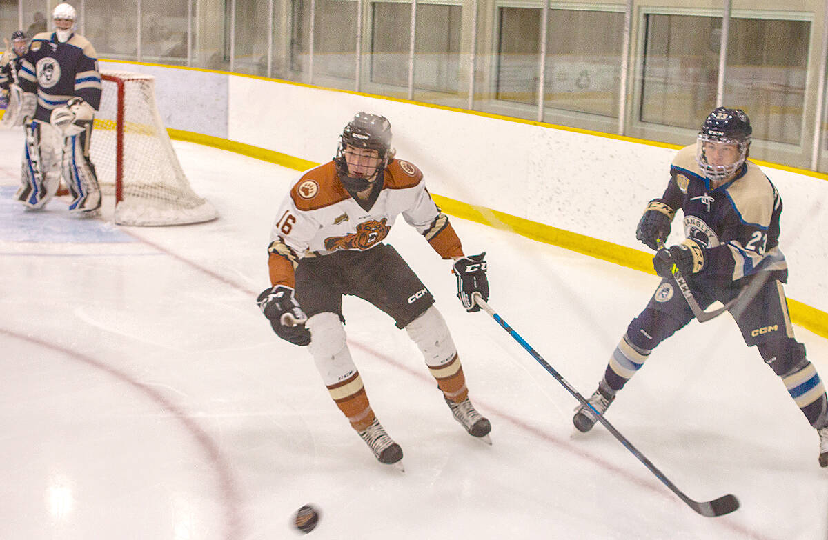 Kodiaks forward Slatts Gregory and Trappers defenceman Tyler Shaughnessy chase the puck at Aldergrove Credit Union Community Arena, the two Langley teams second meeting of the season. (Kurt Langmann/Special to Black PressMedia)