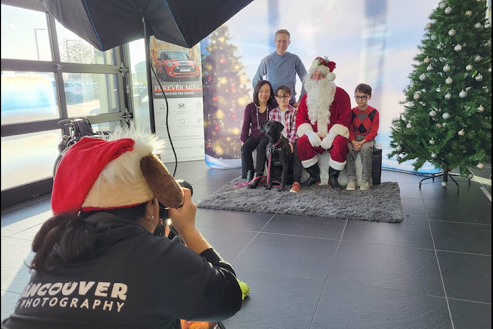 Maddy, a one-year-old lab cross from Cloverdale, bought the whole family to 91ԭ for a photo with Santa on Sunday, Nov. 27. Hosted by the OpenRoad Auto Group Mini dealership in 91ԭ City, the event raised funds for the 91ԭ Animal Protection Society. (Dan Ferguson/91ԭ Advance Times)