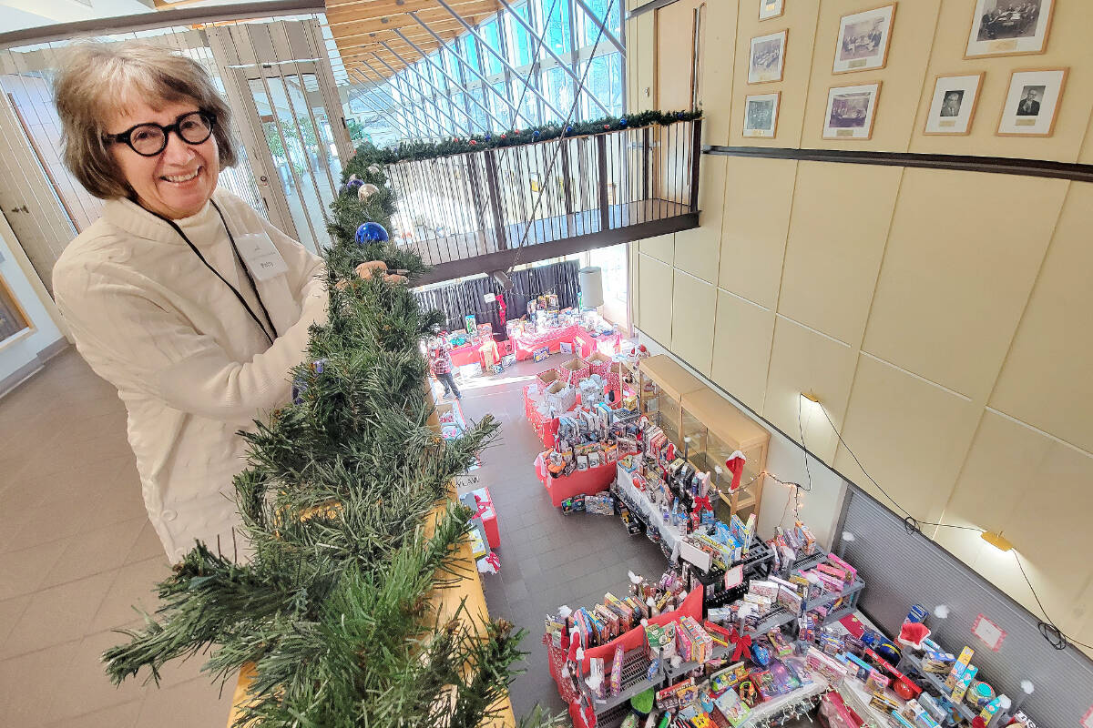 Patty Lester, 91原创 Christmas Bureau coordinator, overlooks the main gift sorting area set up in the foyer of 91原创 City Hall. This year, the Bureau is short of family sponsors, at a time when demand is high. (Dan Ferguson/91原创 Advance Times)
