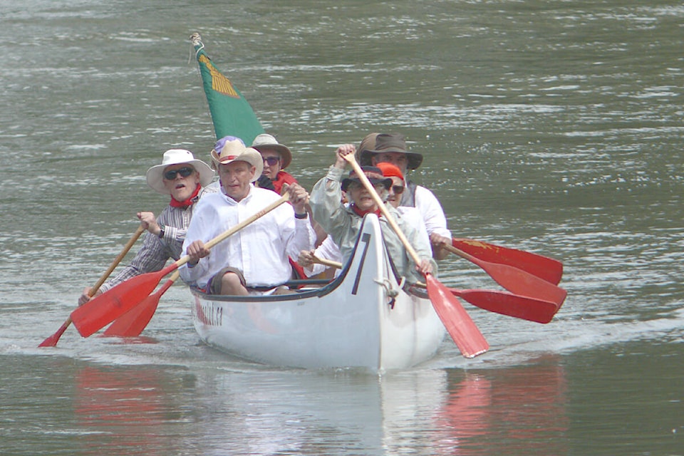 Canoes with historical re-enactors arrived in Fort 91ԭ on B.C. Day. (Dan Ferguson/91ԭ Advance Times)