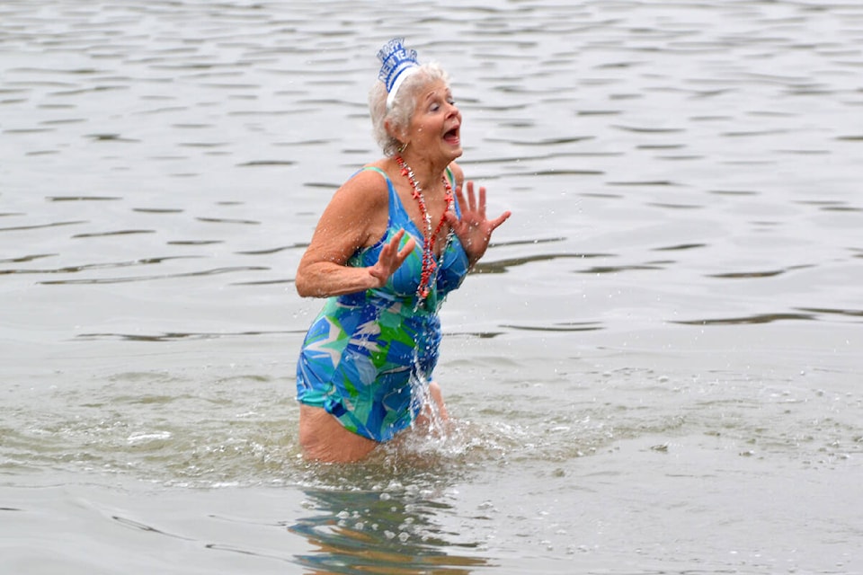 ”Dorothy Humberstone, a 76-year-old resident of Fort Langley, takes the polar bear swim challenge in the Bedford Channel waters. Humberstone has been participating in the event for years and brought dozens of family members to join her this year.