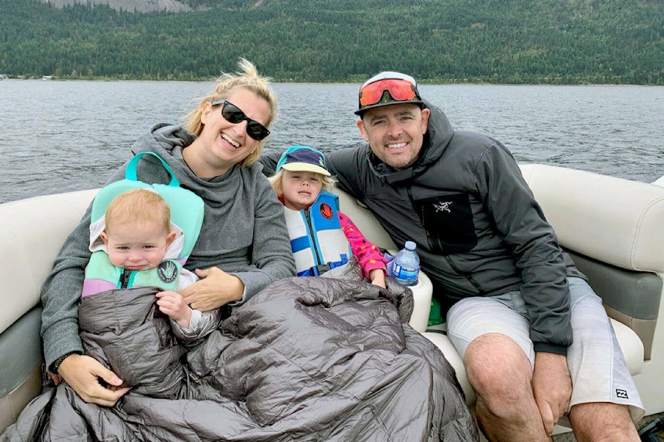 Erin Easingwood, husband Stu, with Lily and Ellie. The Langley lawyer retired from the profession after 15 years to go sailing full-time with her family. (www.skookumsailing.ca)