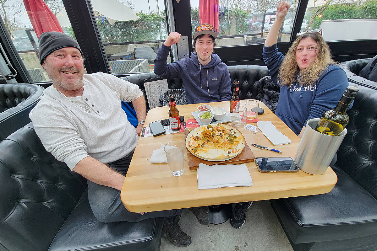 Dad Kevin, son Ashton and mom Kim from Willowbrook were glad to 聭get out of the house聮 to watch their first post-COVID Super Bowl.