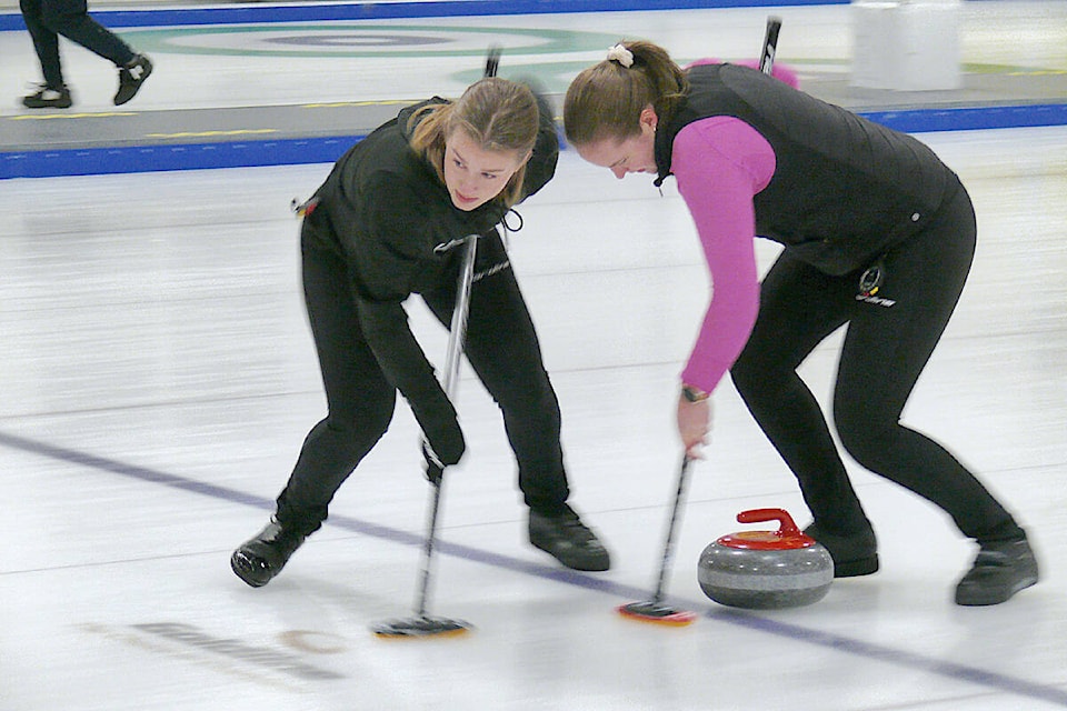 Team Grandy second Lindsay Dubue (left) and lead Sarah Loken were practicing at the Langley Curling Centre on Tuesday Feb. 14, the last before the team headed to the Scotties. (Dan Ferguson/Langley Advance Times)