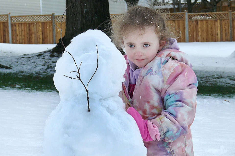 Rylee, 5, was making a snowman in Aldergrove on Sunday, Feb. 26 after a heavy overnight snowfall dump. (Dan Ferguson/Langley Advance Times)