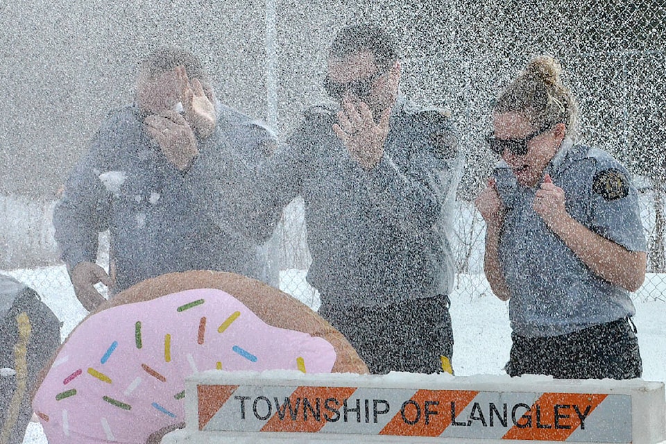 Some Langley RCMP officers (and two firefighters) were soaked with a fire hose Tuesday, February 28, as part of the Polar Plunge fundraiser for B.C. Special Olympics. (Dan Ferguson/Langley Advance Times)