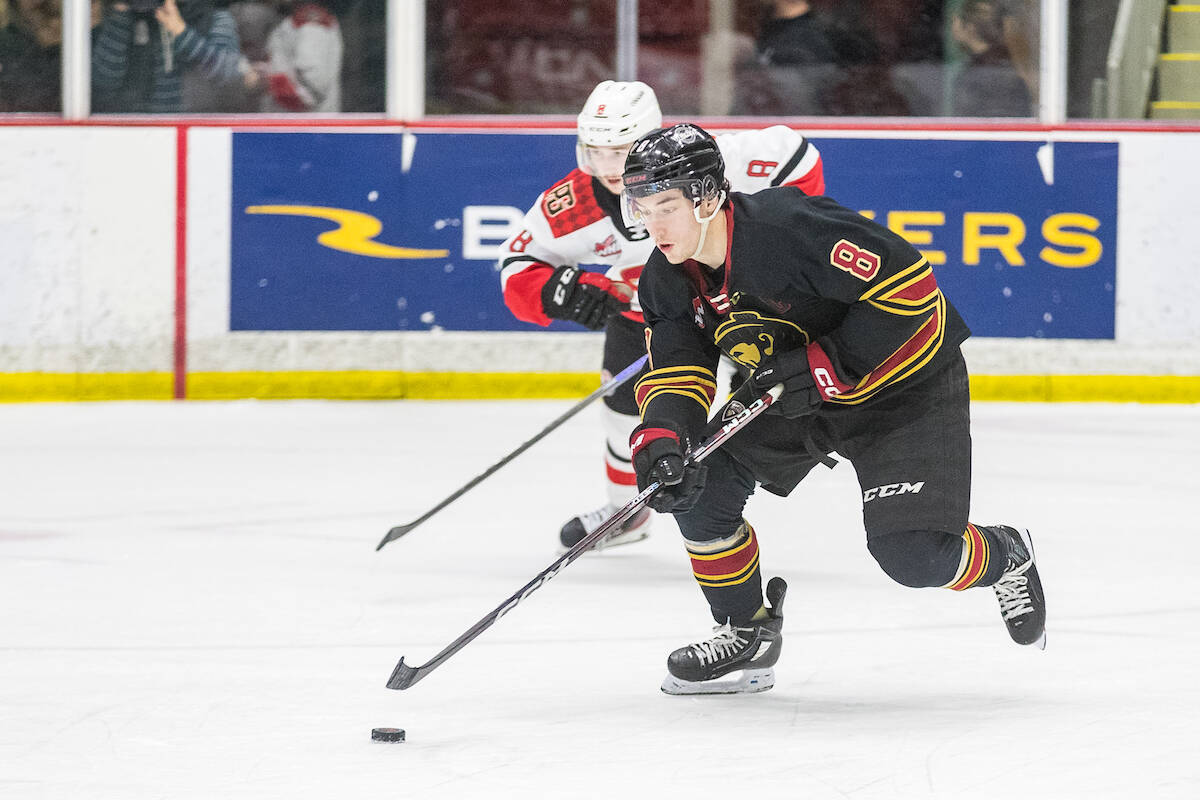 Giants Captain Ty Thorpe tried to shake off Cougars winger Caden Brown as Prince George blanked Vancouver 6-0 at the CN Centre on Tuesday, Feb. 28. (James Doyle/Special to Langley Advance Times)