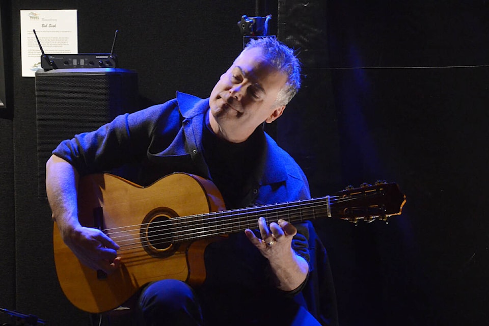John Gilliat performed on the guitar at the West Fine Art show from March 3-5 in 91ԭ. (Matthew Claxton/91ԭ Advance Times)