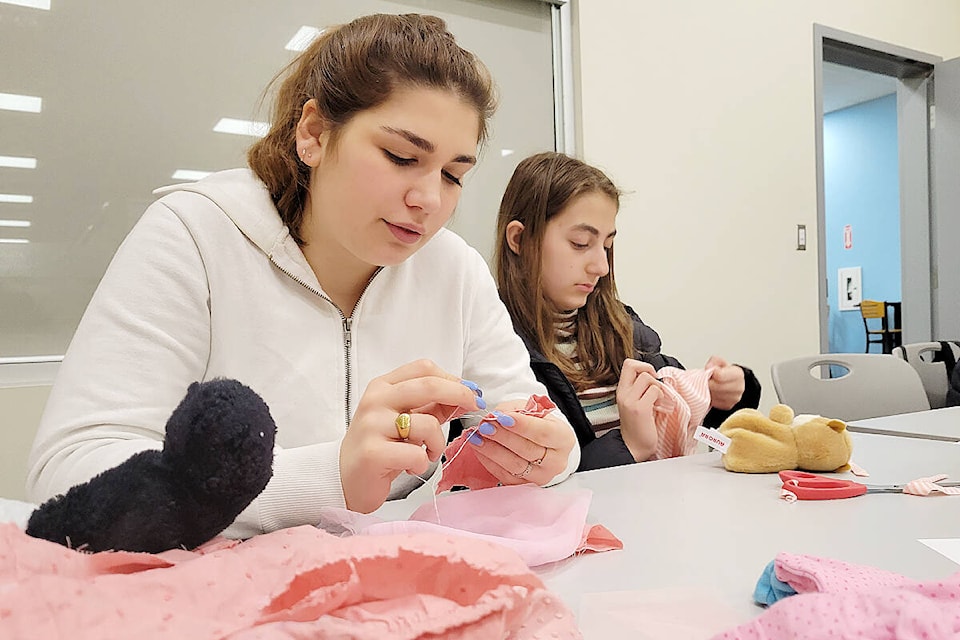 ‘An introduction to miniature fashion design and alterations’ drew more than 20 people to the Langley City branch of the Fraser Valley Regional Library to try their hand at making clothing for dolls and plush toys on Saturday, March 25. (Dan Ferguson/Langley Advance Times)