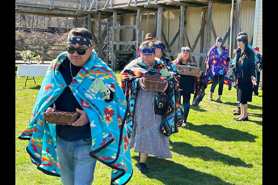 Members of the Sq’éwlets First Nation carry artifacts from Kilby Historic Site with their final destination being the Sq’éwlets community. Kilby staff, provincial officials and local First Nations elders also recently repatriated several baskets to the nearby Sts’ailes First Nation. (Adam Louis/Observer)