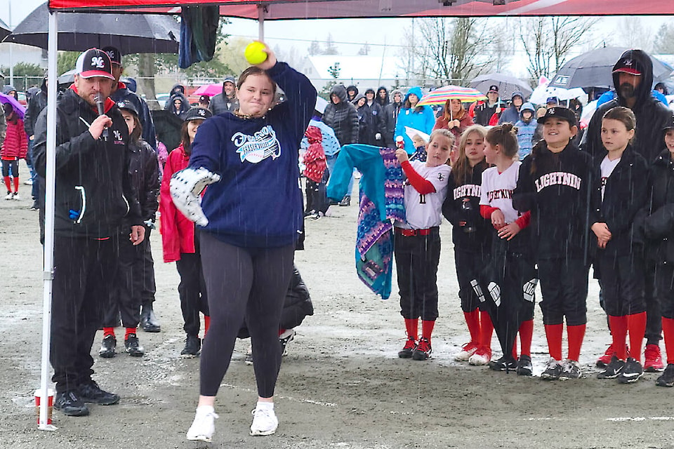 Langley’s Jessica Heutink threw the ceremonial first pitch during a damp official opening of the North Langley Softball 2023 season at Yorkson Community Park on Saturday, April 8. (Special to Langley Advance Times)