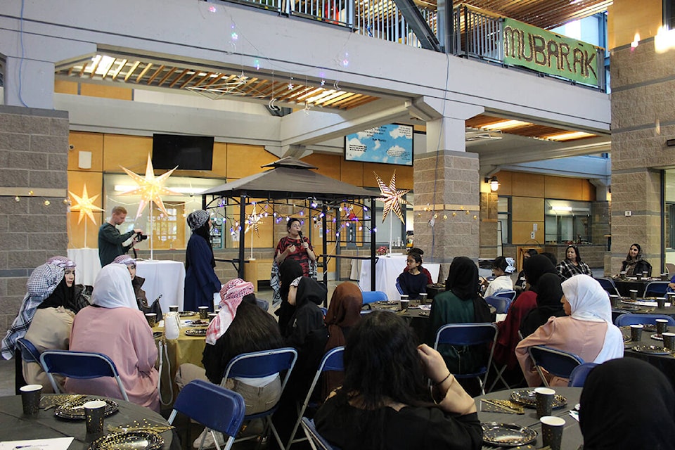 L.A. Matheson Secondary’s Iftar event brought in more than 50 people, including Muslim and non-Muslim students, staff, and community members. Speaking is Annia Ohana, who helped students organize the event. (Sobia Moman photo)