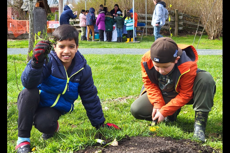 Kids were taught how to remove weeds from the garden at outdoor classes LEPS hosted on Wednesday, April 19. (Kyler Emerson/Langley Advance Times)