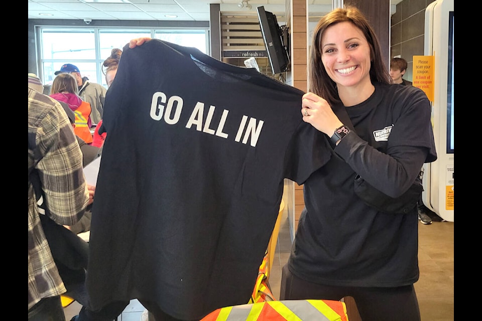 Christine Turley, co-owner of Murrayville Plumbing, alongside her husband, Spencer, organized a community clean up for Earth Day on Saturday, April 22. (Kyler Emerson/91ԭ Advance Times)