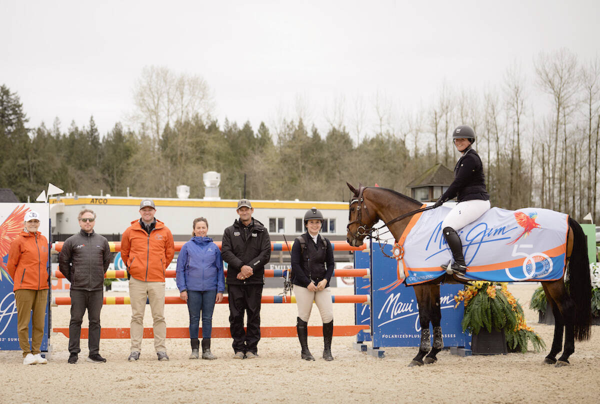 Kassidy Keith and Havana stand for the winner聮s presentation after taking Sunday聮s (April 23) $10,000 Maui Jim Grand Prix 1.40m at Thunderbird Show Park. (tbird/Quinn Saunders)