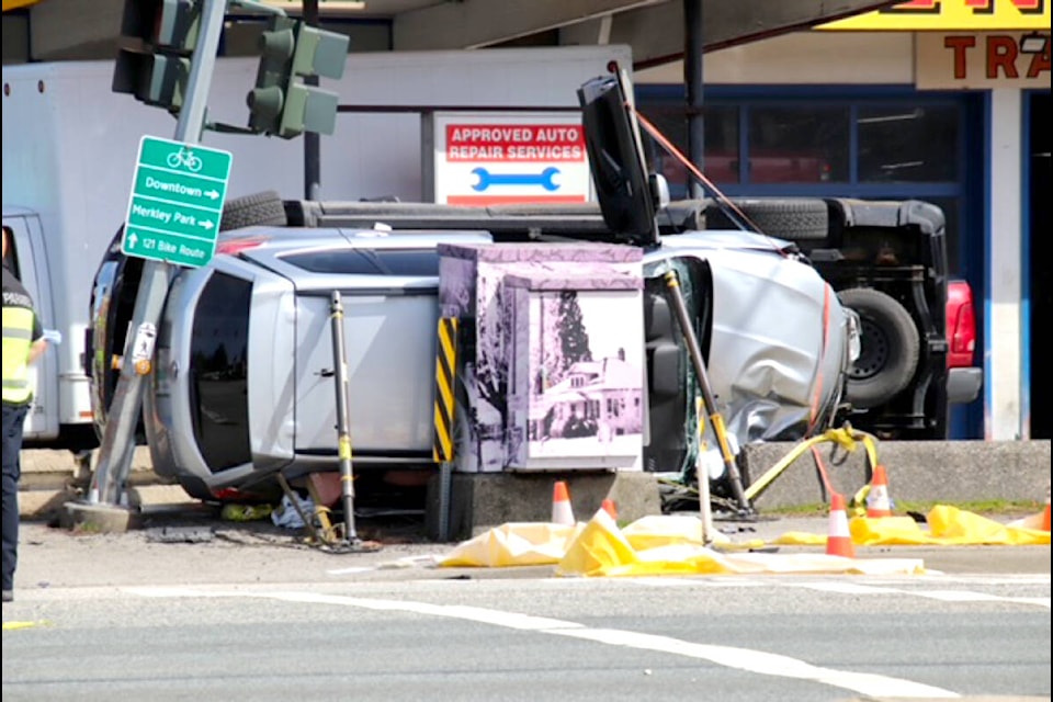 A traffic collision at Laity Street and Lougheed Highway involving a pedestrian resulted in two vehicles being flipped onto their sides late Thursday morning. (Shane MacKichan/Special to The News