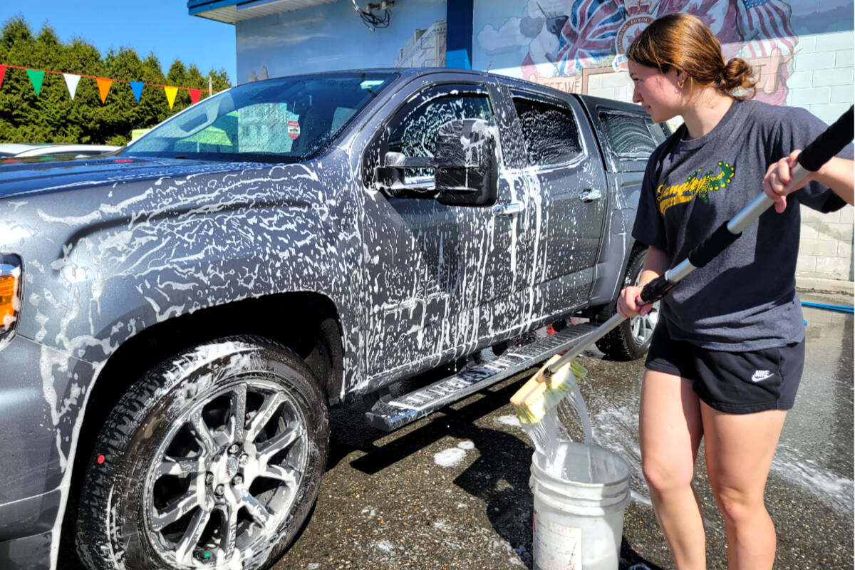 Ruby Bagnall, Grade 12 student, washed cars to raise funds for dry grad on Saturday, April 29. (Kyler Emerson/Langley Advance Times)