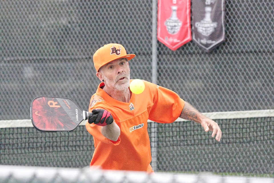 Darin Edwards returned a shot Sunday, April 30 at the pickleball courts in Langley City’s Douglas Park. He estimated he devotes as much as seven hours a day to the fast-growing sport. (Dan Ferguson/Langley Advance Times)