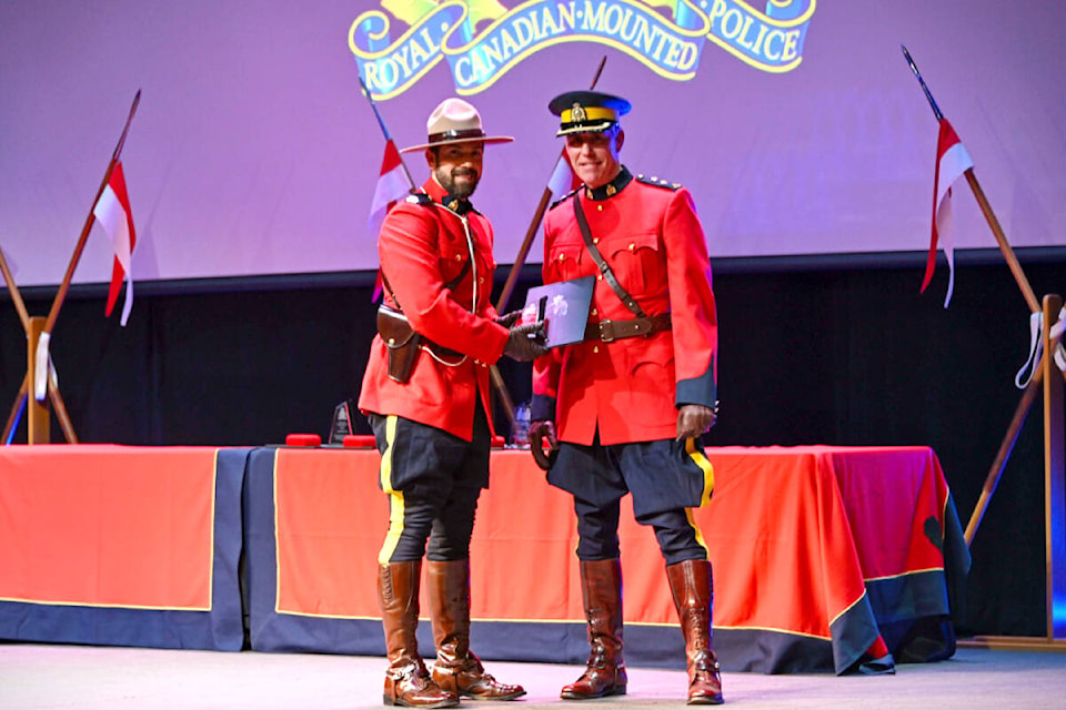 Langley RCMP held its detachment awards ceremony honouring police officers, dispatchers, call-takers, and community members, including Const. Davide Minchella (left) receiving his commendation from Supt. Adrian Marsden. (Langley RCMP/Special to Langley Advance Times)