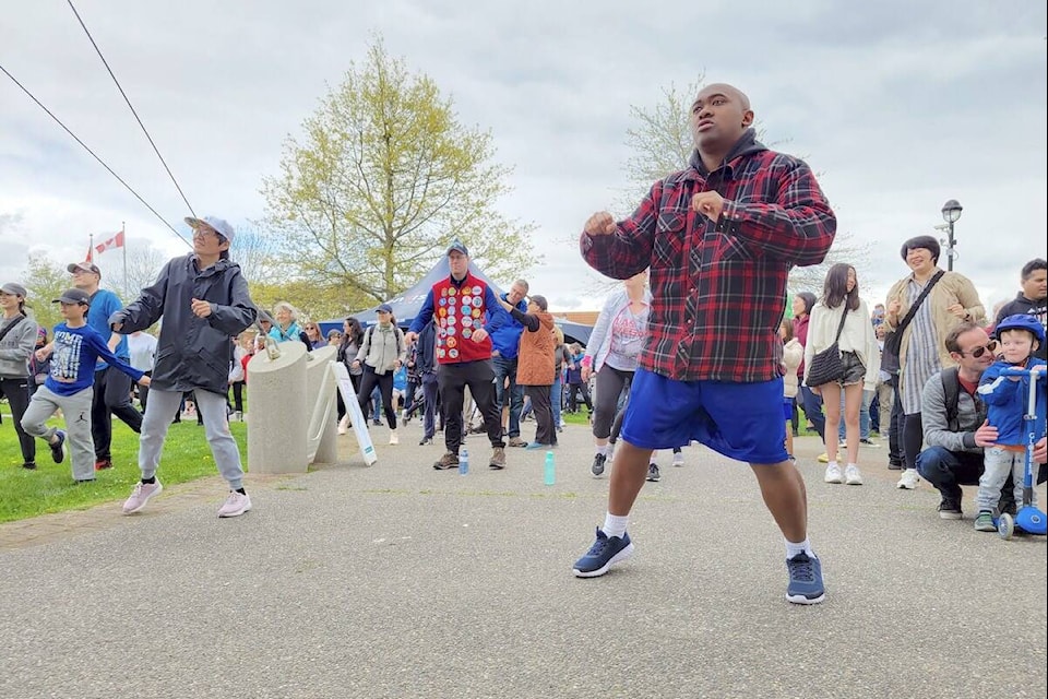 More than 350 people took part in the 61st annual Langley walk, warming up before setting out from Langley City’s Douglas Park. (Dan Ferguson/Langley Advance Times)