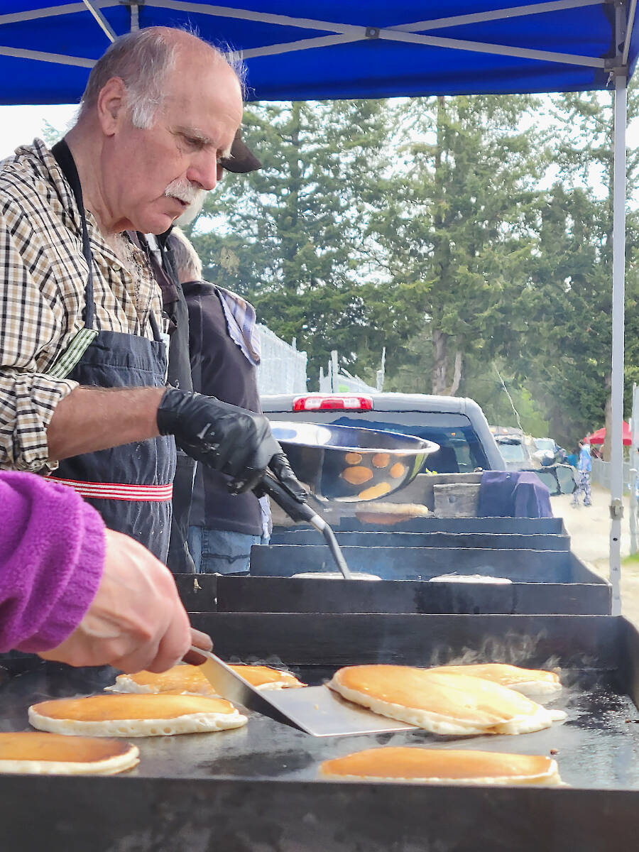 Fort Langley Lions whipped up pancake breakfasts at the start of the 34th D.W. Poppy Secondary School car show fundraiser on Sunday, May 7.500 cars and 2,000 car fans attended .(Dan Ferguson/Langley Advance Times)