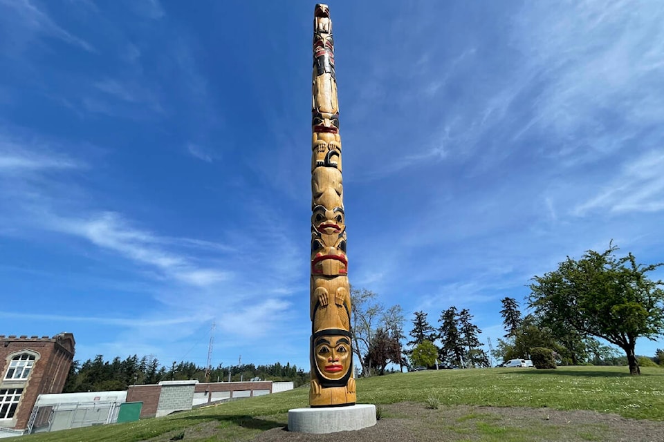 The 12-and-a-half metre totem pole carved by about 160 inmates which stands outside the Vancouver Island Regional Corrections Centre in Saanich. (Austin Westphal/News Staff)
