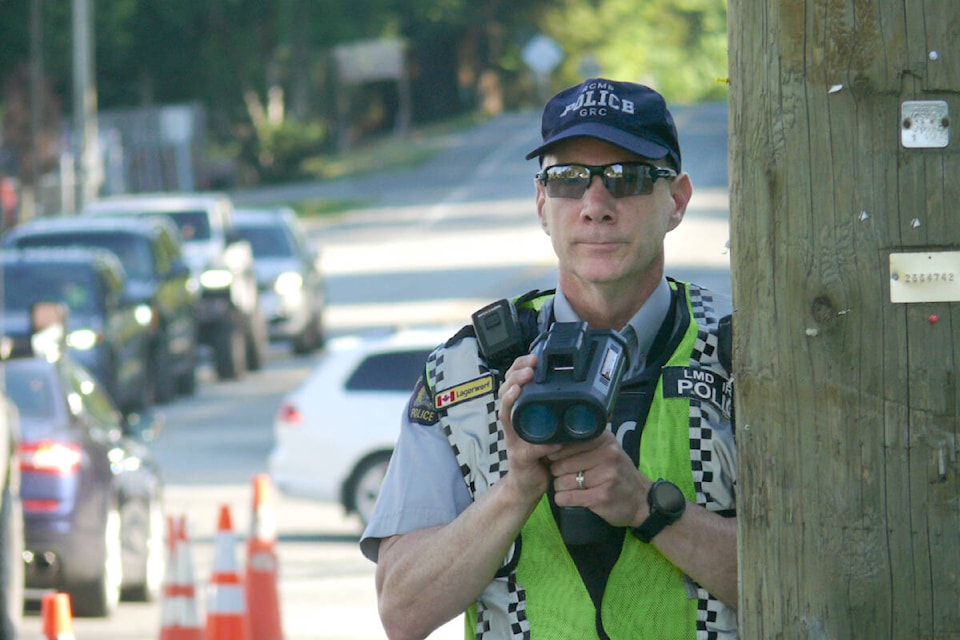 An officer was looking for speeders near 240th Street and Fraser Highway in Aldergrove on Monday, May 15. It was the start of the 13th annual B.C. Cone Zone Campaign. (Dan Ferguson/Langley Advance Times)