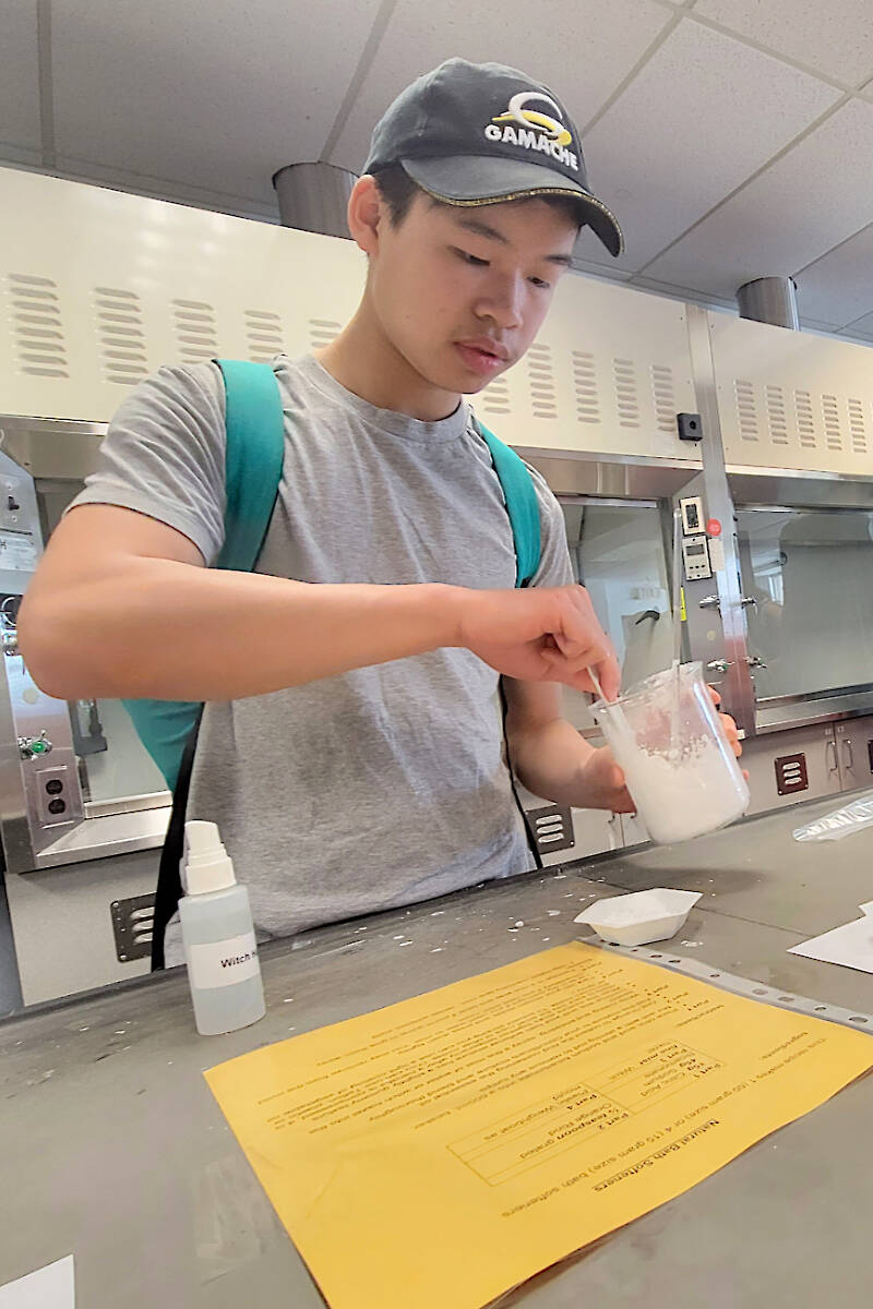 Justin Gu, 14, from Willoughby, was trying his hand at making natural bath softeners from scratch at Kwantlen Polytechnic University in Langley City on Saturday, May 13. He was one hundreds of young people who turned out for Science Rendezvous. (Dan Ferguson/Langley Advance Times)
